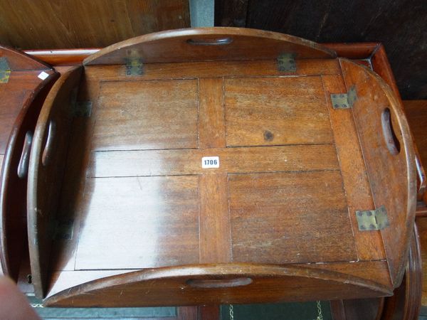 A 19th century oval mahogany butler's tray with drop sides, 74cm wide, together with a similar smaller, 58cm wide. (2)