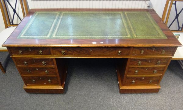 A 19th century mahogany pedestal desk with nine drawers about the knee, 15cm wide.