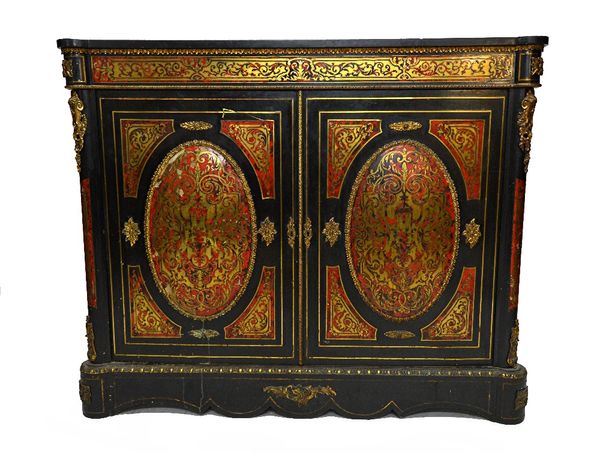 A 19th century ebonised gilt metal mounted Boulle work side cabinet, with pair of convex oval panel doors on plinth base, 137cm wide.  Illustrated