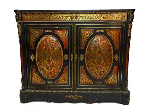 A 19th century ebonised gilt metal mounted Boulle work side cabinet, with pair of convex oval panel doors on plinth base, 137cm wide.  Illustrated