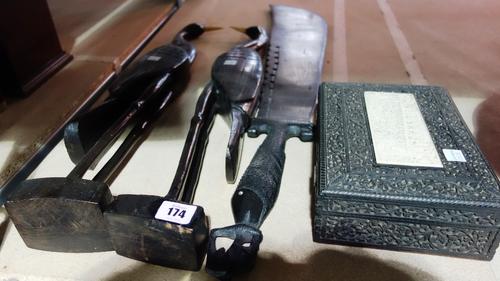A group of carved ebony items including a pair of birds, large knife and a box. (qty)