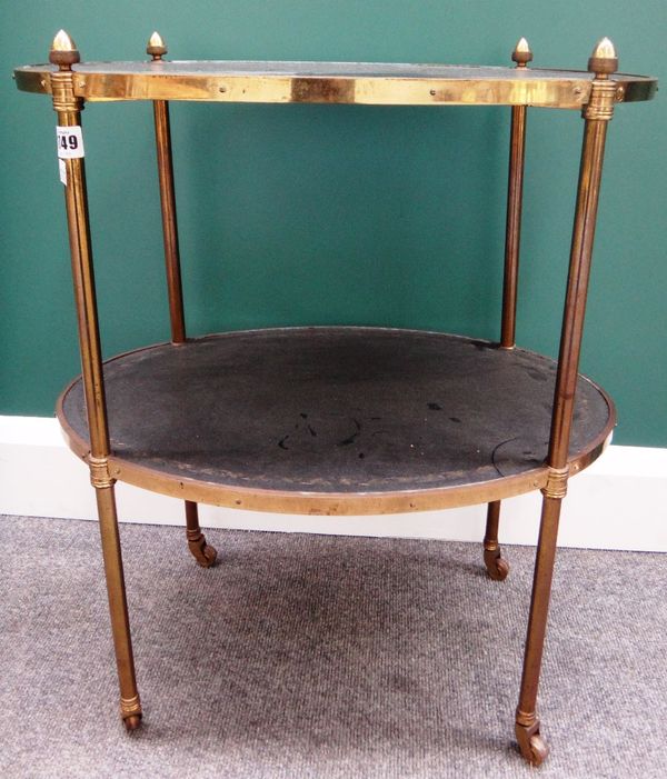 A 19th century lacquered brass oval two tier étagère, with gilt tooled black leather platforms and turned supports, 54cm wide.