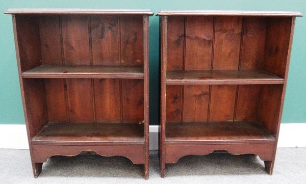 A pair of small pine two tier open bookcases with slab end supports, 61cm wide.