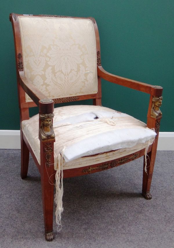 An early 20th century French gilt metal mounted mahogany open armchair with caryatid mounted tapering square supports.