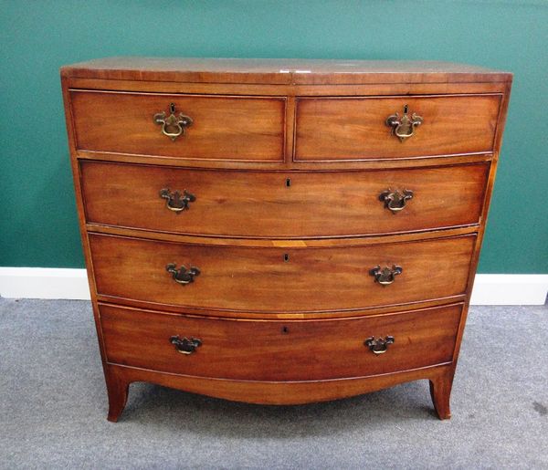 An early 19th century mahogany bow front chest of two short and three long graduated drawers on splayed bracket feet, 105cm wide.