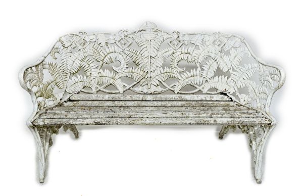 A suite of Coalbrookdale design white painted fern and berry pattern garden seats comprising; a bench, 152cm wide, and a pair of tub chairs, each 66cm