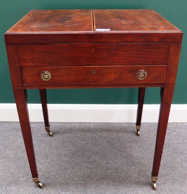 A George III tulipwood banded mahogany dressing table, the double lift top enclosing a fitted interior over single drawer on tapering square supports,