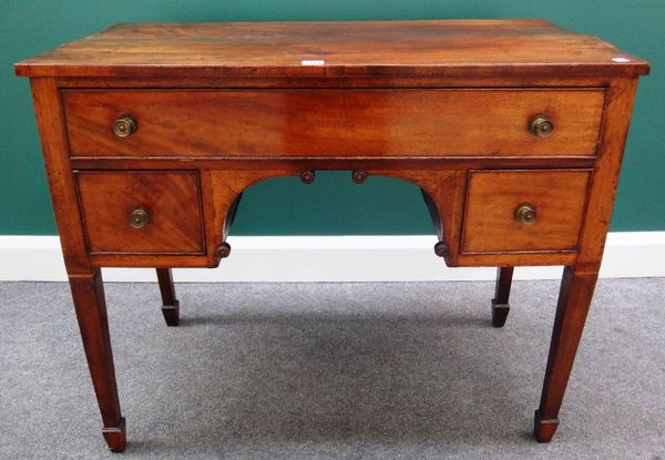 An early 19th century mahogany lowboy with three drawers about the arch frieze, on tapering square supports, 93cm wide.