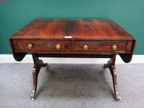 A George III inlaid rosewood sofa table, with a pair of frieze drawers and dummy opposing, on trestle end standards and four downswept supports, 97cm