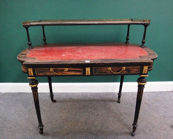 A 19th century gilt metal mounted coromandel writing desk, the galleried shelf back over a rounded rectangular plateau and two frieze drawers on taper