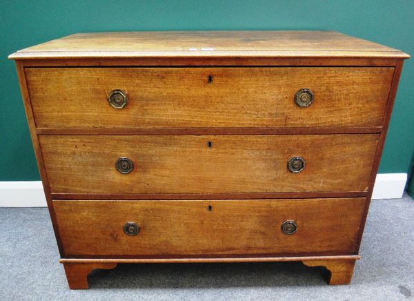 A George III mahogany chest of three long graduated drawers, on bracket feet, 110cm wide.