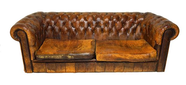 A 20th century brown leather button upholstered Chesterfield sofa, 235cm wide.  Illustrated