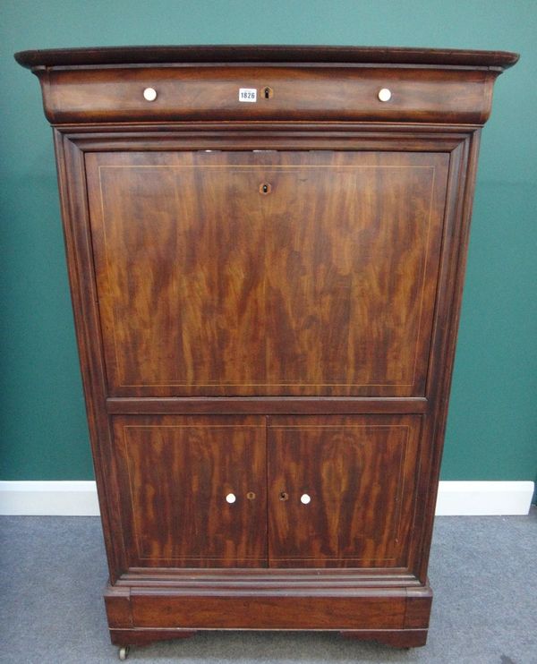 A mid-19th century Continental inlaid mahogany secretaire a abattant, the single drawer over fall front, revealing a fitted interior above a pair of c