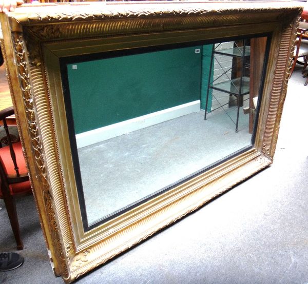 A large 19th century rectangular wall mirror with deep floral moulded frame, 200cm x 141cm.