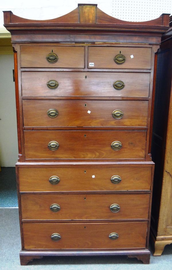 A George III mahogany chest on chest, the shaped cornice over two short and six long drawers, on bracket feet, 112cm wide x 196cm high.