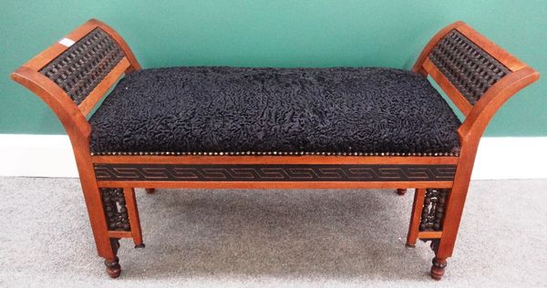 An early 20th century hardwood framed Moorish window seat, with extensive turned decoration, 97cm wide.