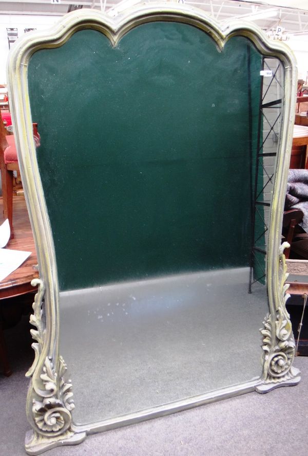 A large 19th century later green painted wall mirror, with shaped arch top and acanthus scroll lower bracket, 143cm wide x 178cm high overall.