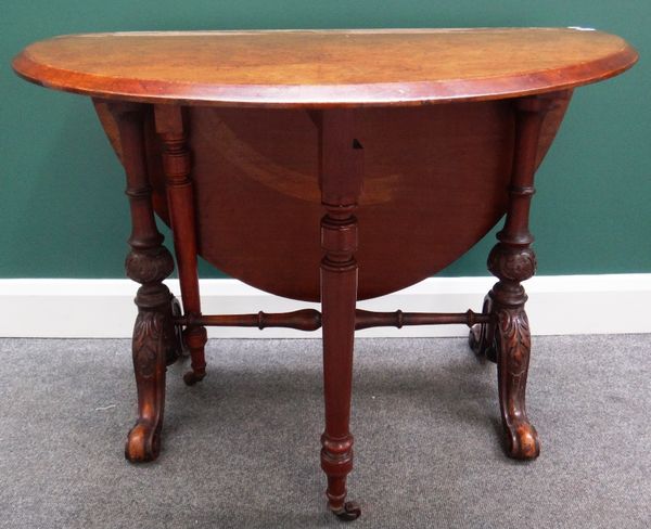 A Victorian figured walnut Sutherland table, the oval top on a pair of baluster turned columns and four downswept supports, 90cm wide.