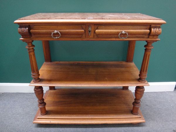 A 19th century French buffet, the rectangular marble inset top with pair of frieze drawers above two open tiers on turned supports, 105cm wide.