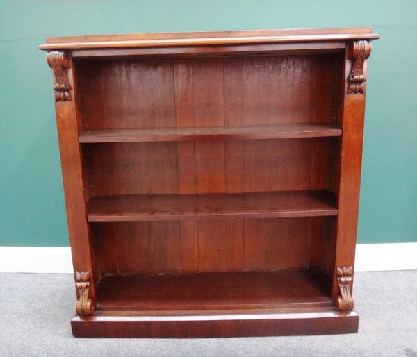 A Victorian walnut floor standing open bookcase, with scroll mounts on plinth base, 115cm wide.