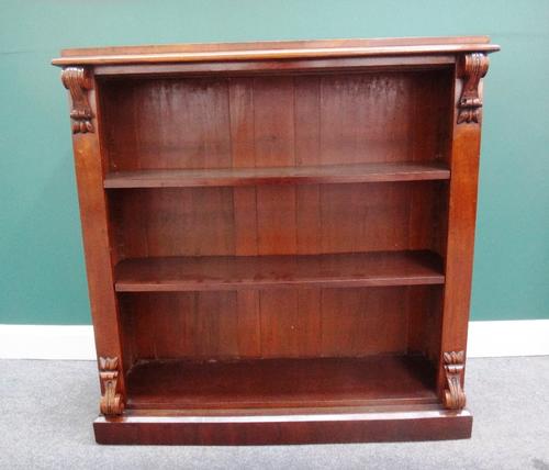A Victorian walnut floor standing open bookcase, with scroll mounts on plinth base, 115cm wide.