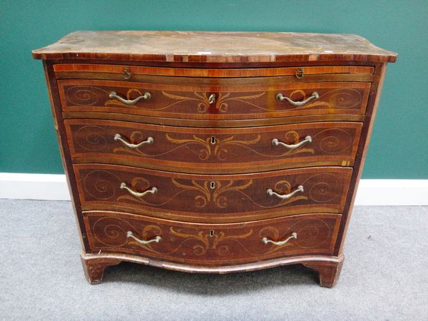 A 19th century marquetry inlaid mahogany serpentine chest, the brushing slide over four long graduated drawers on bracket feet, 106cm wide.