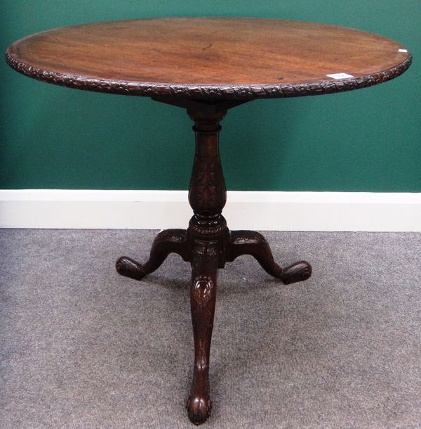 A George III and later mahogany tripod table, the circular oak snap top on a birdcage mount and carved tripod base, 78cm wide.