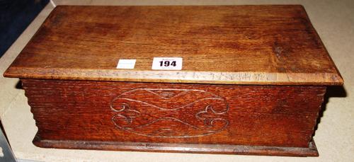 A rectangular oak box with a lift top, circa 1840, inscribed 'Oak from the roof of St George's Chapel, Windsor'.