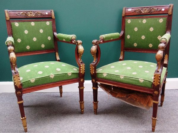 A pair of Empire design parcel gilt mahogany open armchairs, with swan's head finial, on tapering square supports.