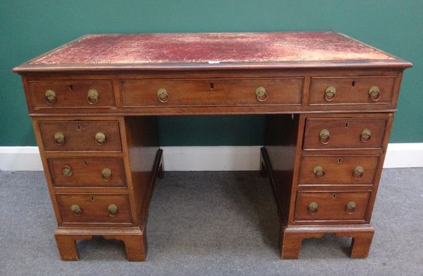 A 19th century mahogany pedestal desk, with nine drawers about the knee, on bracket feet, 120cm wide.