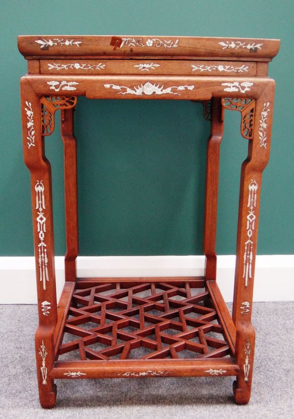 An early 20th century bone inlaid Chinese hardwood urn stand, with secret frieze drawer on four in-stepped square supports, united by a cockpen platfo