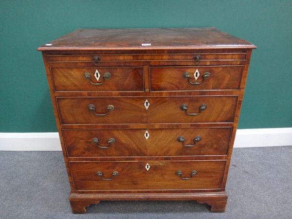 A George III mahogany chest, the brushing slide over two short and three long graduated drawers, on bracket feet, 77cm wide.