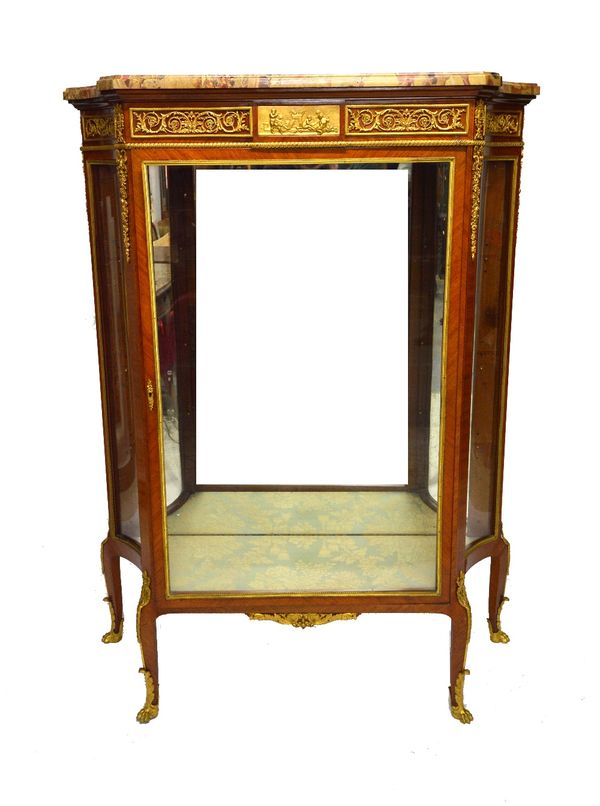 An 18th century style French ormolu mounted Kingwood vitrine, the marble top over a glazed central door, flanked by swept sides, on four cabriole supp