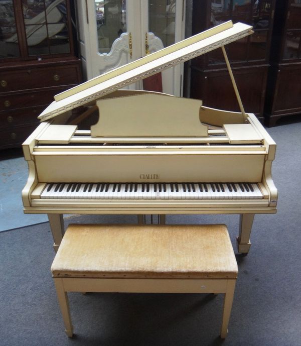 A white painted iron framed over strung baby grand piano by 'Challen' on tapering square supports, with Harrods retail plaque, 145cm deep.