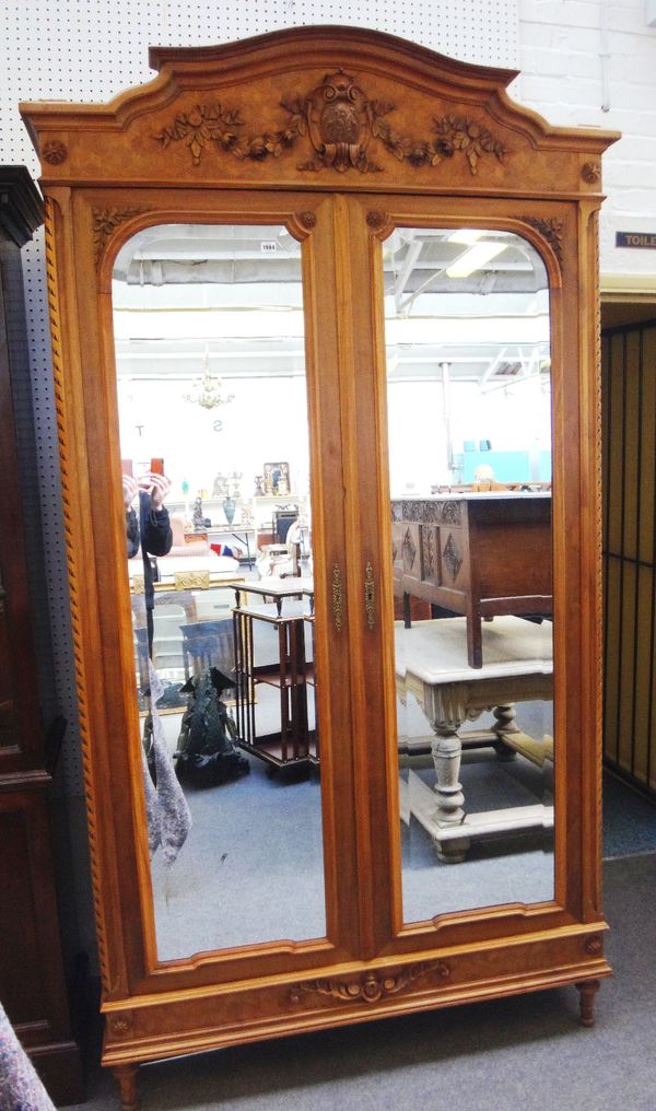 A 20th century French deceptive cube parquetry inlaid walnut wardrobe with pair of bevelled mirror doors, 134cm wide x 246cm high.