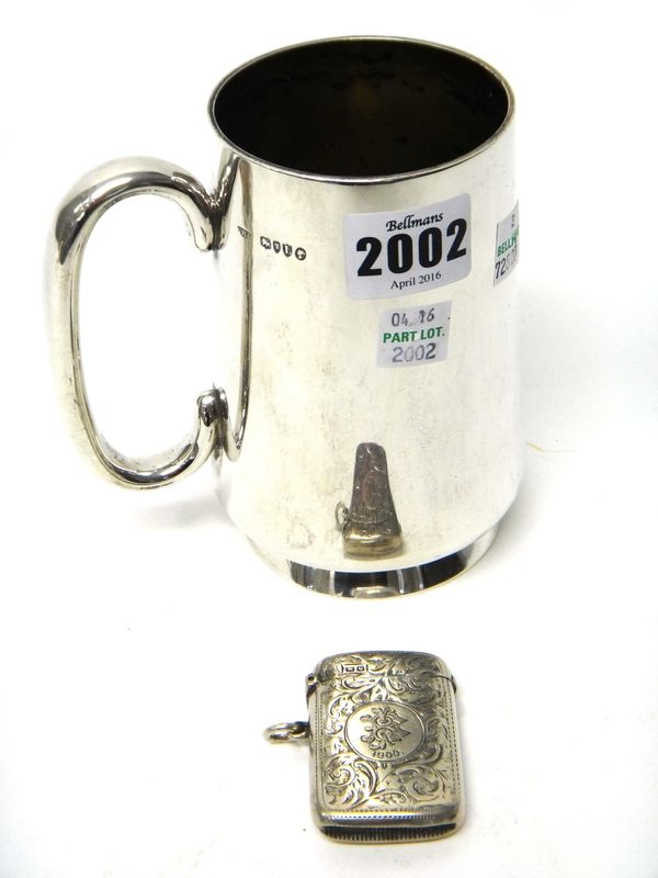 A Victorian silver mug, of tapering cylindrical form, with a 'C' shaped handle and on a circular foot, London 1886 and a silver rectangular vesta case