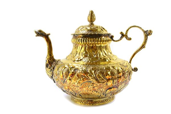 A European silver gilt teapot, of baluster form, the body with floral and foliate scroll embossed decoration, the spout terminating as a mask, the det