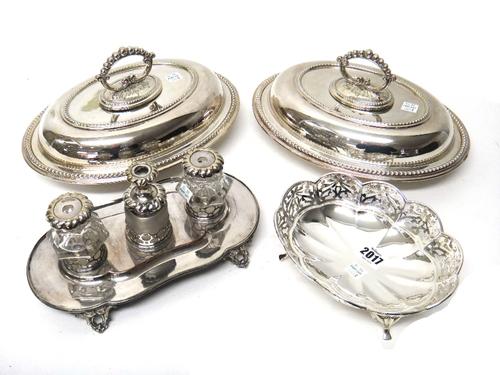 A silver oval bonbon dish, of lobed form, decorated with pierced sides and raised on four Art Nouveau legs, Birmingham 1911, weight 166 gms, an old Sh