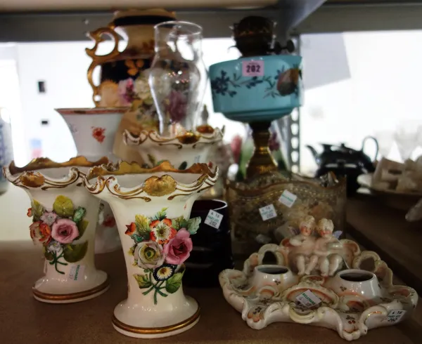 A quantity of decorative ceramics including vases, figure groups, an oil lamp and sundry. (qty)