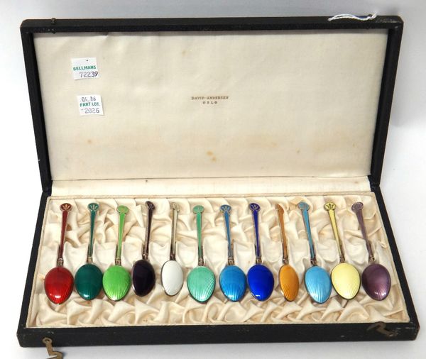 A set of twelve Norwegian silver gilt and vari coloured enamel coffee spoons by David Andersen, Oslo, detailed David Andersen Norway Sterling, with th