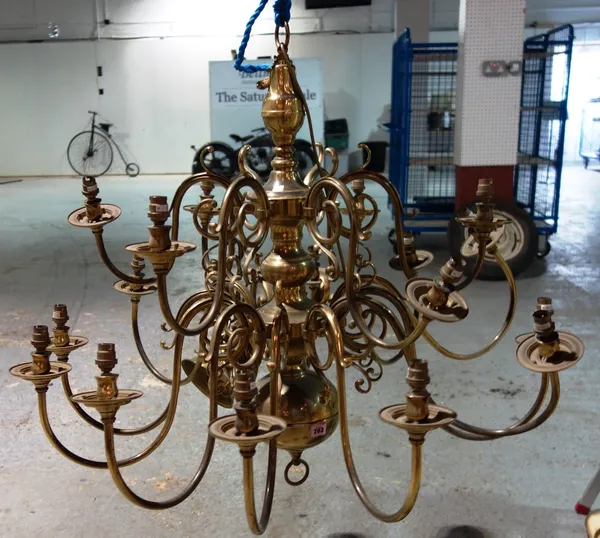 A Dutch style brass chandelier, fitted for electricity.