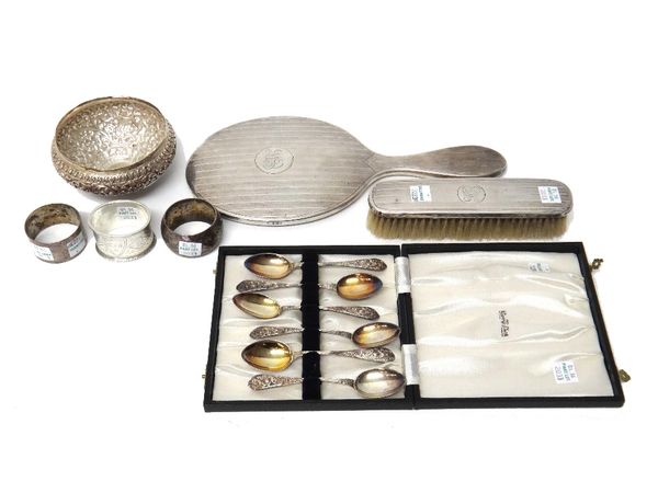 Silver, comprising; a set of six teaspoons, Birmingham 1892 and 1893, with a later case, three napkin rings, a silver mounted hand mirror, a silver mo