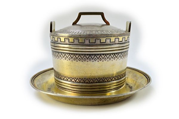 A Russian butter tub and detachable cover, decorated with engraved borders and with an integral circular stand to the base, St Petersburg 1872, diamet