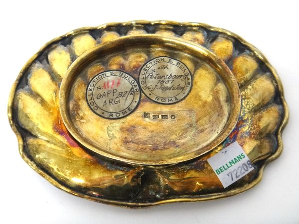 A Russian gilt dish, of shaped oval scalloped shallow form, on an oval foot, St Petersburg 1851, the underside with two circular labels, detailed Coll