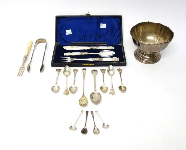 Silver and silver mounted wares, comprising; a bowl of panel shaped form, on a circular foot, a pair of sugar tongs, a christening spoon, four condime