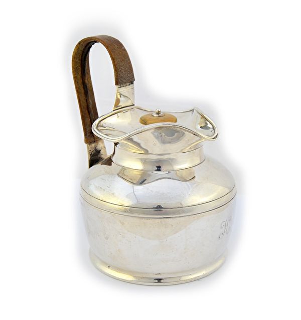 A Scottish silver lidded jug, of circular form, having a detachable triform lid and with a leather bound handle, Edinburgh 1904, gross weight 382 gms.