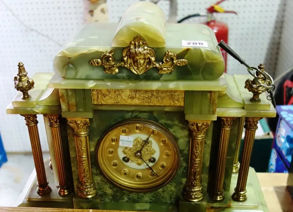 An onyx and gilt metal mounted eight day mantel clock.