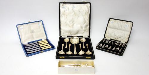 A set of six silver fruit spoons and a larger silver fruit serving spoon, Sheffield 1947, combined weight 262gms, cased, a set of six tea knives, case