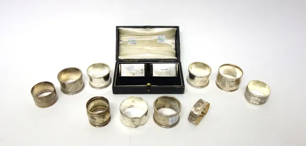 A pair of silver napkin rings, having reeded edges, Birmingham 1923, a pair of silver napkin rings, having beaded edges, Birmingham probably 1917, a p