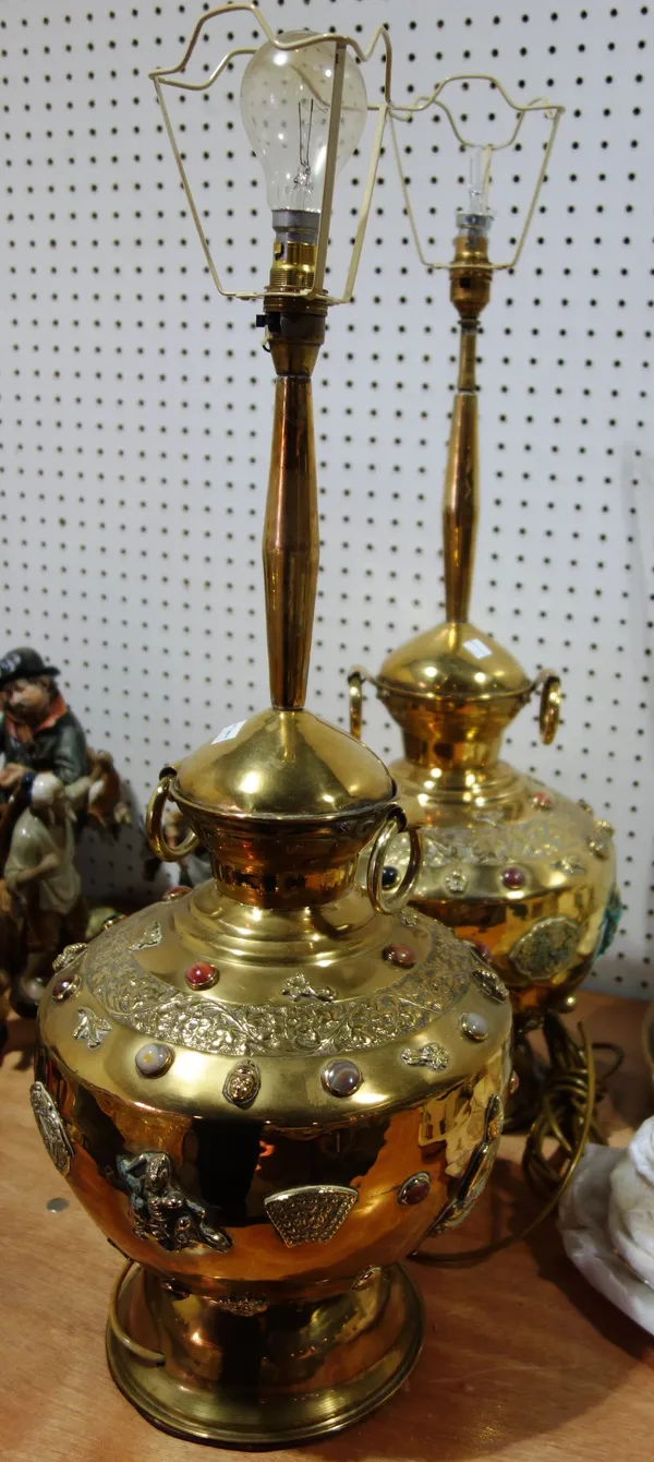 A pair of large Oriental brass table lamps with applied Buddha and stone set decoration. (2)